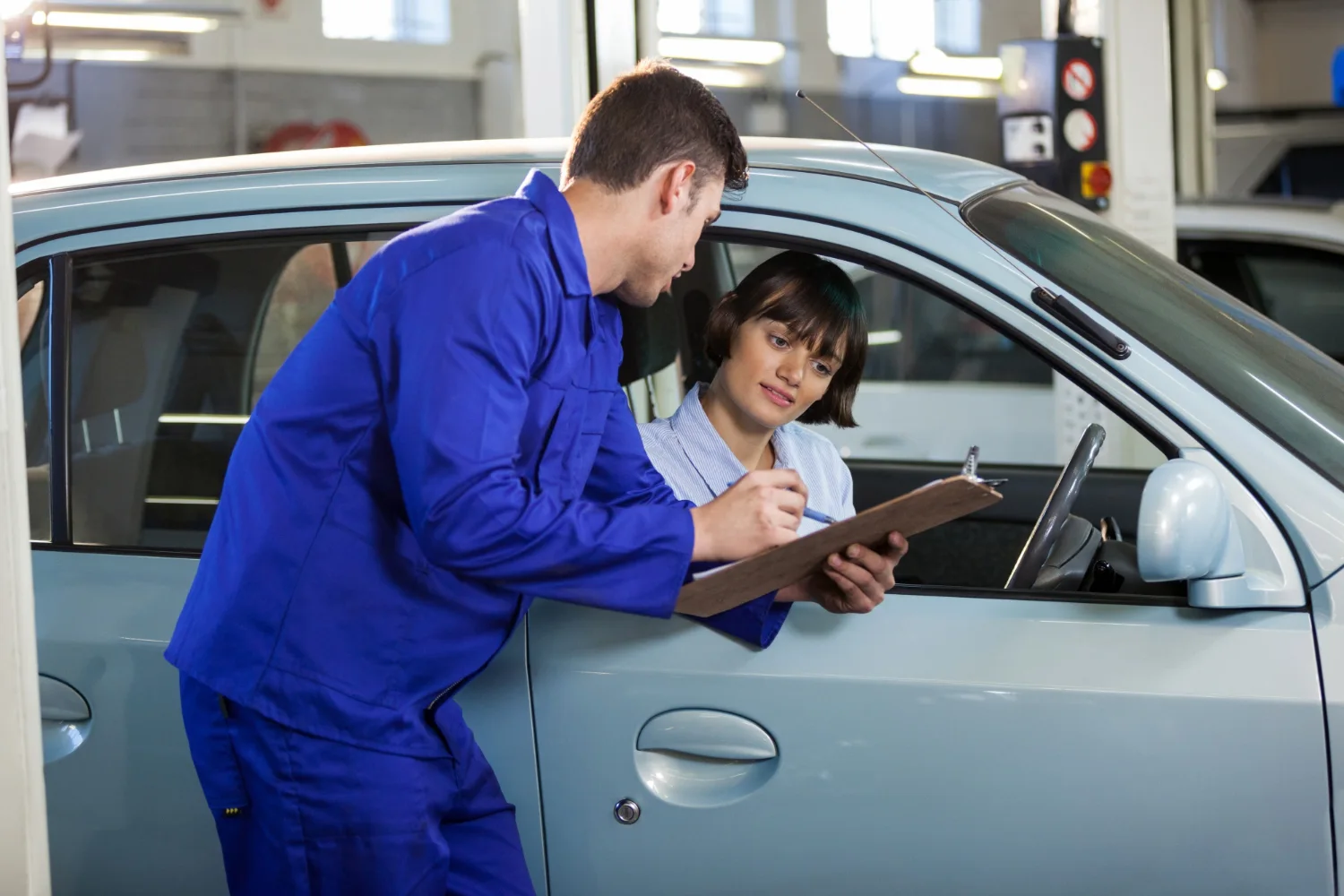  Mechanic explaining car repair report to customer in auto service center, Kuwait
heading - Customer-Focused Approach